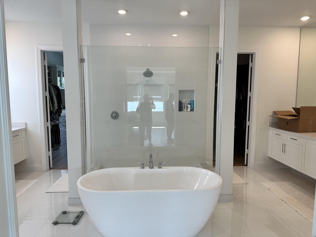 Freestanding bathtub and glass shower
